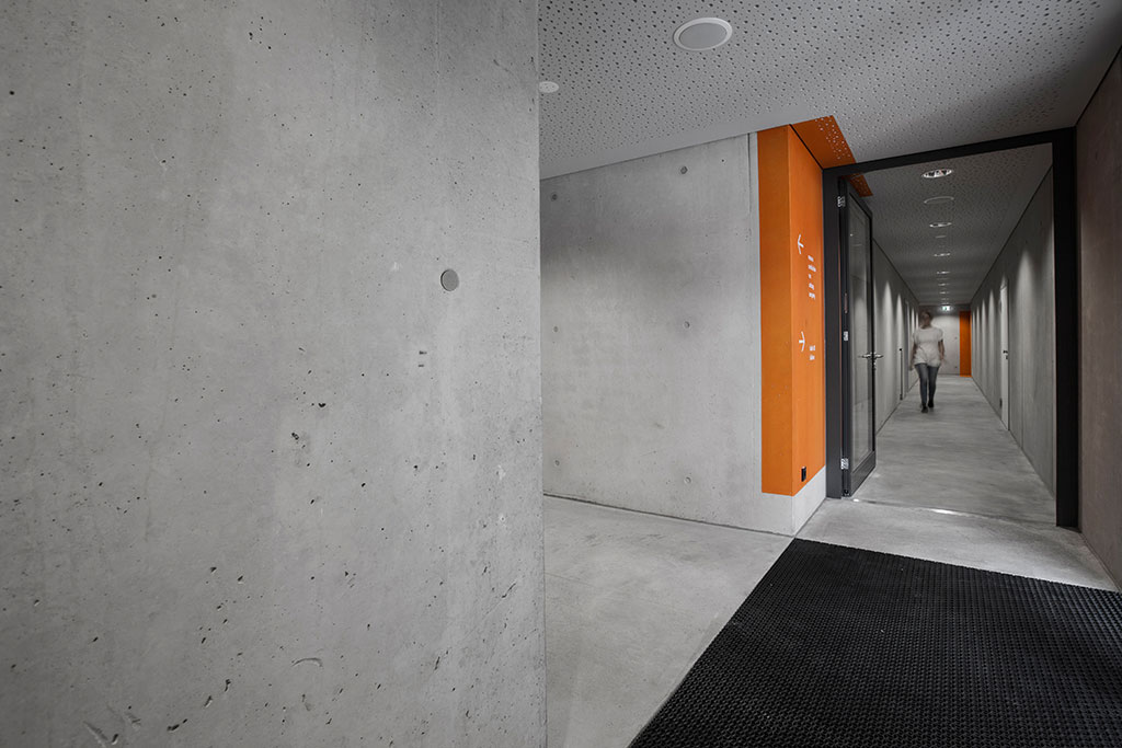 orientation system concrete orange swatches corridor gym multipurpose hall information